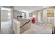 Upstairs landing with neutral tones, showing access to bedrooms and laundry room at 1012 Kings Bottom Dr, Fort Mill, SC 29715