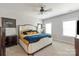 Bright bedroom featuring a neutral color scheme, carpet flooring, ceiling fan, and abundant natural light at 1036 Riverwalk Pkwy, Rock Hill, SC 29730