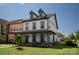 Charming two-story home featuring a welcoming front porch and well-manicured lawn at 1036 Riverwalk Pkwy, Rock Hill, SC 29730