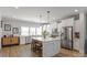 Bright kitchen featuring stainless steel appliances, quartz countertops, and a center island with seating at 1036 Riverwalk Pkwy, Rock Hill, SC 29730