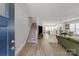 Open-concept living room with hardwood floors seamlessly connects to the kitchen and dining area at 1036 Riverwalk Pkwy, Rock Hill, SC 29730