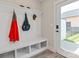 Convenient mudroom featuring a built-in bench with storage and coat hooks near the entrance at 1036 Riverwalk Pkwy, Rock Hill, SC 29730