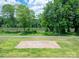Elevated view of the riverwalk logo stamped in concrete, with a lush green landscape and river view at 1036 Riverwalk Pkwy, Rock Hill, SC 29730