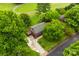 Aerial view of charming home with large yard, mature trees, and spacious driveway with deck at 103A N Tracy St, Kings Mountain, NC 28086