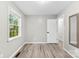 Bedroom featuring light gray walls, wood floors, and a window with tree views at 103A N Tracy St, Kings Mountain, NC 28086
