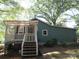 View of backyard with a partially covered porch and steps to the yard at 1051 S Brady Ave, Newton, NC 28658