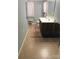 Bathroom with dual sink vanity and neutral color scheme at 1051 S Brady Ave, Newton, NC 28658