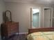 Bedroom showing wood-look floors, a wardrobe and a walk-in closet at 1051 S Brady Ave, Newton, NC 28658