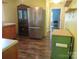 Kitchen with stainless steel refrigerator and classic wood cabinets at 1051 S Brady Ave, Newton, NC 28658
