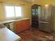 Kitchen featuring stainless steel refrigerator and classic wood cabinets at 1051 S Brady Ave, Newton, NC 28658