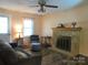 Spacious living room with fireplace, neutral tones, and comfortable seating at 1051 S Brady Ave, Newton, NC 28658