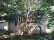 Exterior of the outbuilding showing door and window at 1051 S Brady Ave, Newton, NC 28658