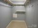 Walk-in closet featuring a built-in shelving unit and plenty of storage space at 1051 S Brady Ave, Newton, NC 28658