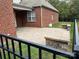 Spacious brick-paved backyard patio, perfect for entertaining, with a view of the green landscape at 10715 Tom Short Rd, Charlotte, NC 28277
