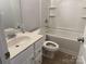 Clean bathroom with a bathtub, toilet, and vanity, featuring neutral tones and essential fixtures at 10715 Tom Short Rd, Charlotte, NC 28277