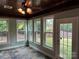 Cozy sun room with slate floors, wood ceiling, large windows, and access to the backyard at 10715 Tom Short Rd, Charlotte, NC 28277