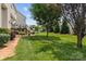Expansive backyard featuring a well-maintained lawn, garden beds, and a deck, perfect for outdoor enjoyment at 108 Planters Dr, Statesville, NC 28677