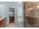 Bathroom with double vanity, soaking tub, glass enclosed shower and tile floor at 108 Planters Dr, Statesville, NC 28677