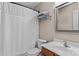 Neat bathroom with a shower curtain, toilet, and a vanity with a framed mirror and overhead lighting at 108 Planters Dr, Statesville, NC 28677