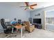 Bedroom with a ceiling fan, neutral walls, carpet and large window with a desk and entertainment area at 108 Planters Dr, Statesville, NC 28677