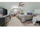 Bedroom with a sloped ceiling, ceiling fan, carpet, and a light green color scheme at 108 Planters Dr, Statesville, NC 28677