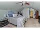 Bedroom with a sloped ceiling, ceiling fan, carpet, and a neutral gray color scheme at 108 Planters Dr, Statesville, NC 28677