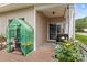 The patio features a greenhouse, seating, and slide door access to the house at 108 Planters Dr, Statesville, NC 28677
