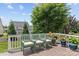 Inviting deck area with comfortable seating and colorful potted plants, offering a relaxing outdoor living space at 108 Planters Dr, Statesville, NC 28677