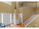 Open foyer with hardwood floors, a staircase and ample natural light from the doorway at 108 Planters Dr, Statesville, NC 28677