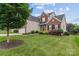 Beautiful two-story home with well-maintained lawn, landscaping and attached garage at 108 Planters Dr, Statesville, NC 28677