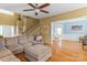 Spacious living room with hardwood floors and a view into the bright adjacent dining room at 108 Planters Dr, Statesville, NC 28677