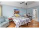 Main bedroom featuring hardwood floors, ceiling fan, sitting area, and good natural light at 108 Planters Dr, Statesville, NC 28677