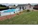 Large backyard featuring manicured lawn, an in-ground pool, and privacy fencing at 111 Brookview Dr, Shelby, NC 28152