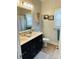 Bright bathroom with double sink vanity, modern fixtures, and a decorative mirror at 111 Brookview Dr, Shelby, NC 28152