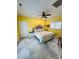 Bright bedroom featuring a ceiling fan, and a king-size bed with neutral bedding, bedside tables, and decorative lamps at 111 Brookview Dr, Shelby, NC 28152