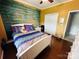 Comfortable bedroom with decorative wood accent wall and lots of natural light at 111 Brookview Dr, Shelby, NC 28152