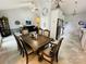 Formal dining area open to kitchen, with elegant table, chandelier lighting, and tiled flooring at 111 Brookview Dr, Shelby, NC 28152