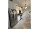 Modern kitchen features stainless steel appliances, including a refrigerator and range, with stylish tiled flooring at 111 Brookview Dr, Shelby, NC 28152
