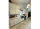 Modern kitchen features stainless steel appliances, including a dishwasher and sink, with stylish tiled flooring at 111 Brookview Dr, Shelby, NC 28152