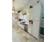 Modern kitchen features stainless steel appliances, including a dishwasher and sink, with stylish tiled flooring at 111 Brookview Dr, Shelby, NC 28152