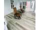 Bright sunroom featuring wood-look floors, sliders, and comfortable seating at 111 Brookview Dr, Shelby, NC 28152