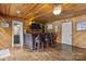 Interior bar area with wood-paneled walls, bar seating, and access to a nearby bathroom at 1111 Palmyra Dr, Fort Mill, SC 29708