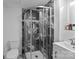 Modern bathroom featuring a stand up shower with black marble tile, sleek fixtures and a white vanity at 1111 Palmyra Dr, Fort Mill, SC 29708