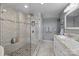 Modern bathroom with glass-enclosed shower, marble countertop vanity, and tiled floors at 1111 Palmyra Dr, Fort Mill, SC 29708