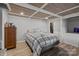 Comfortable bedroom with wood paneled ceiling, natural light, and ample space for relaxation and rest at 1111 Palmyra Dr, Fort Mill, SC 29708