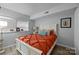 Inviting bedroom with soft blue walls, a white bed frame, and natural light from a window at 1111 Palmyra Dr, Fort Mill, SC 29708