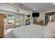 Bright bedroom with lake views, French doors, and an exercise bike inside the house at 1111 Palmyra Dr, Fort Mill, SC 29708