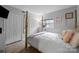 Charming bedroom with a four-poster bed, soft colors, and cozy decor at 1111 Palmyra Dr, Fort Mill, SC 29708