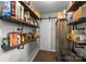 Well-stocked pantry with sleek wooden shelving for organized storage and a sliding barn door at 1111 Palmyra Dr, Fort Mill, SC 29708