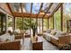 Charming sunroom with floor-to-ceiling windows and stone floor for an immersive outdoor experience at 1111 Palmyra Dr, Fort Mill, SC 29708